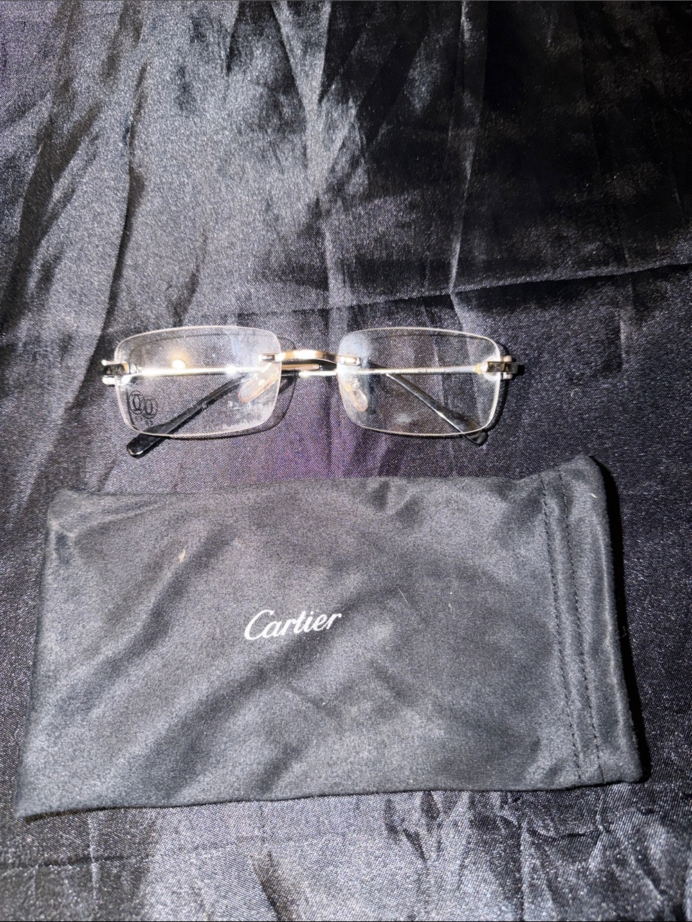 Cartier Menโs Rimless Glasses - Silver Frame, Black Temples